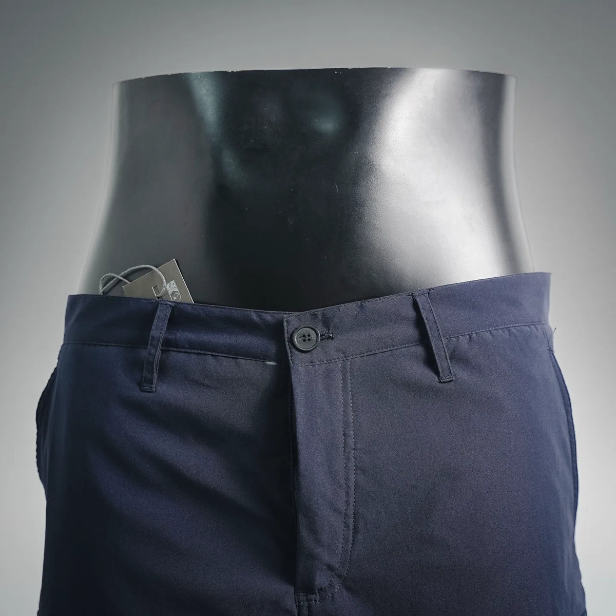 Navy cargo shorts front view with button closure, belt loops, and side pockets
