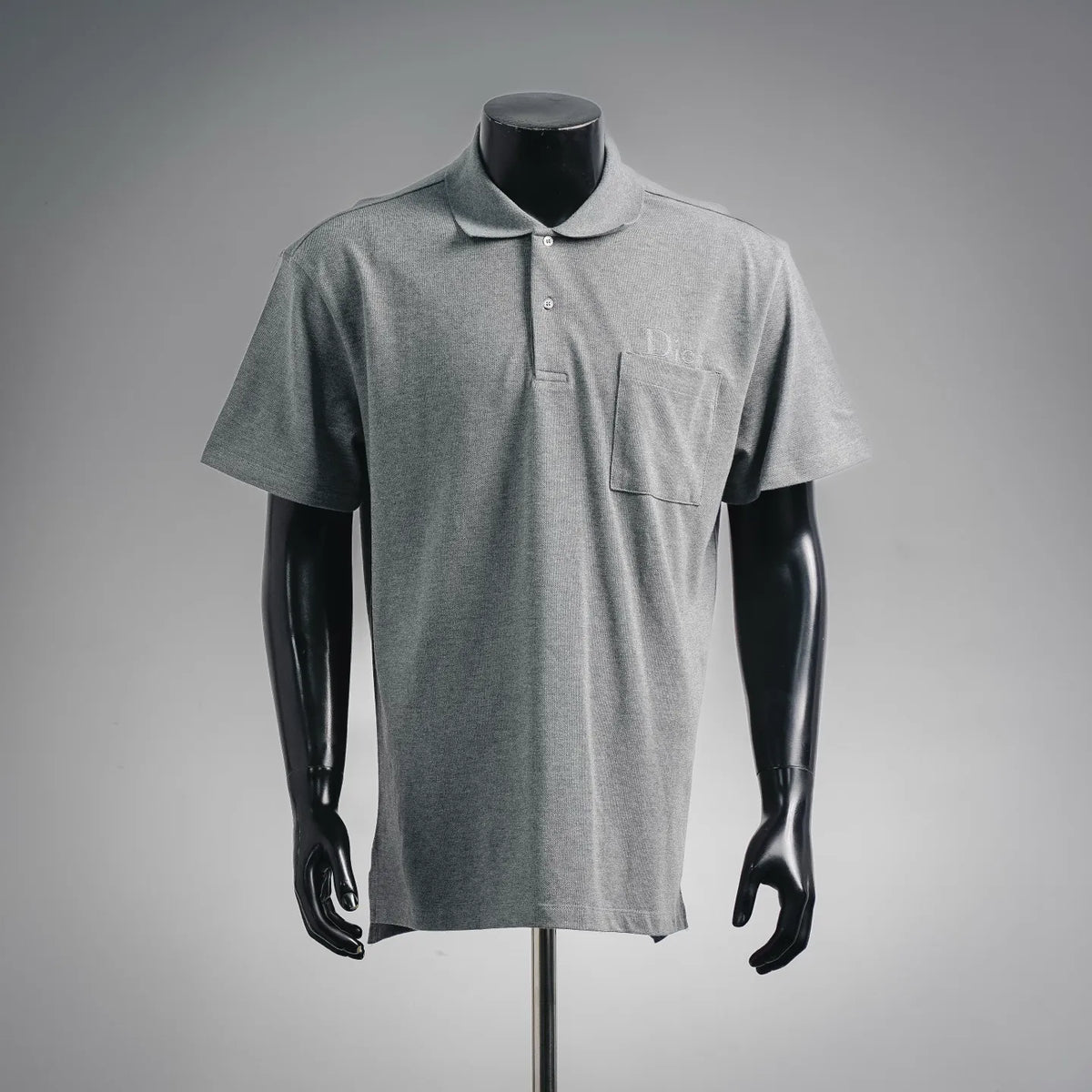 Gray short-sleeve polo shirt with button placket and chest pocket