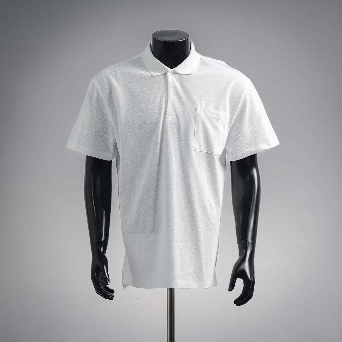 Men's white short-sleeve polo shirt with button placket and chest pocket