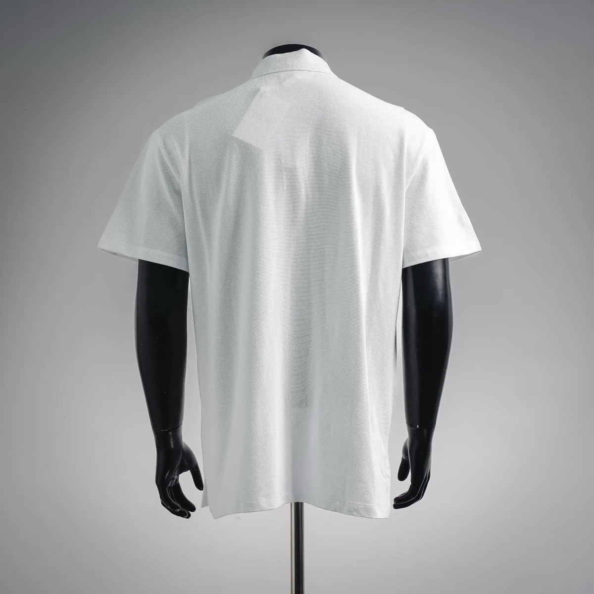 Men's white short-sleeve polo shirt with plain back and folded stand collar