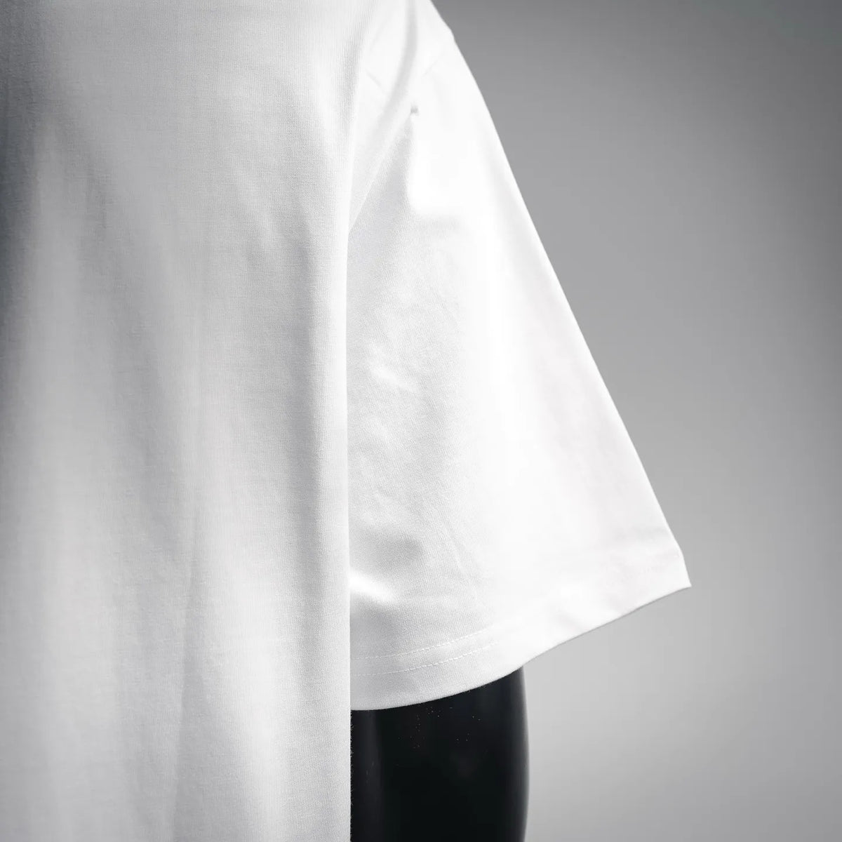 White short-sleeve T-shirt side view, smooth fabric
