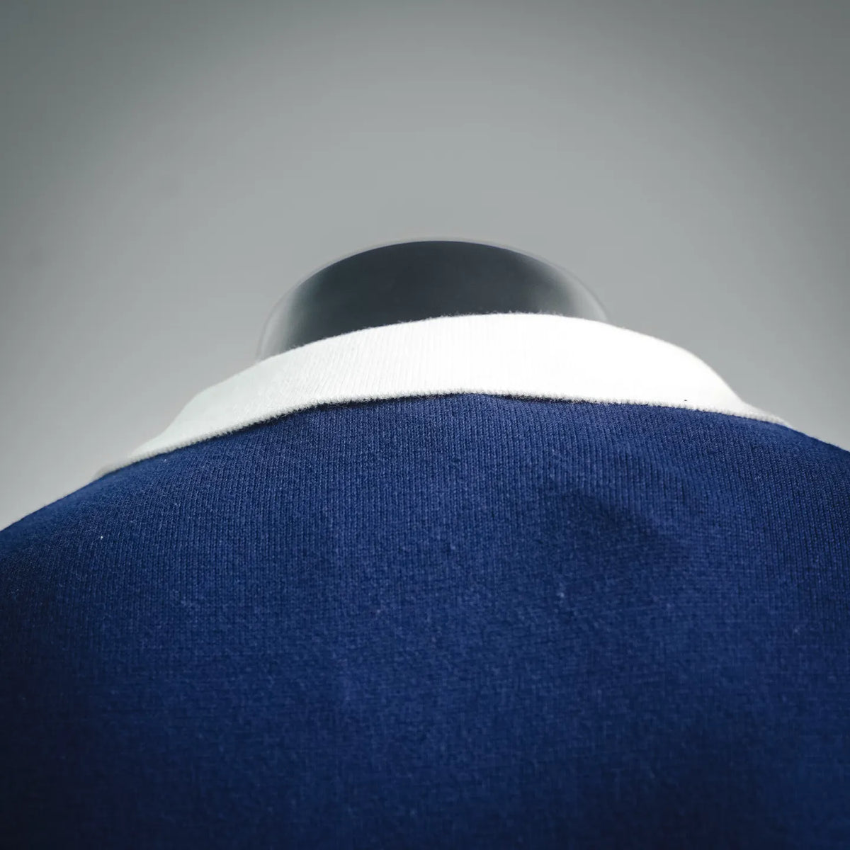 Navy Dior polo shirt collar with white underside