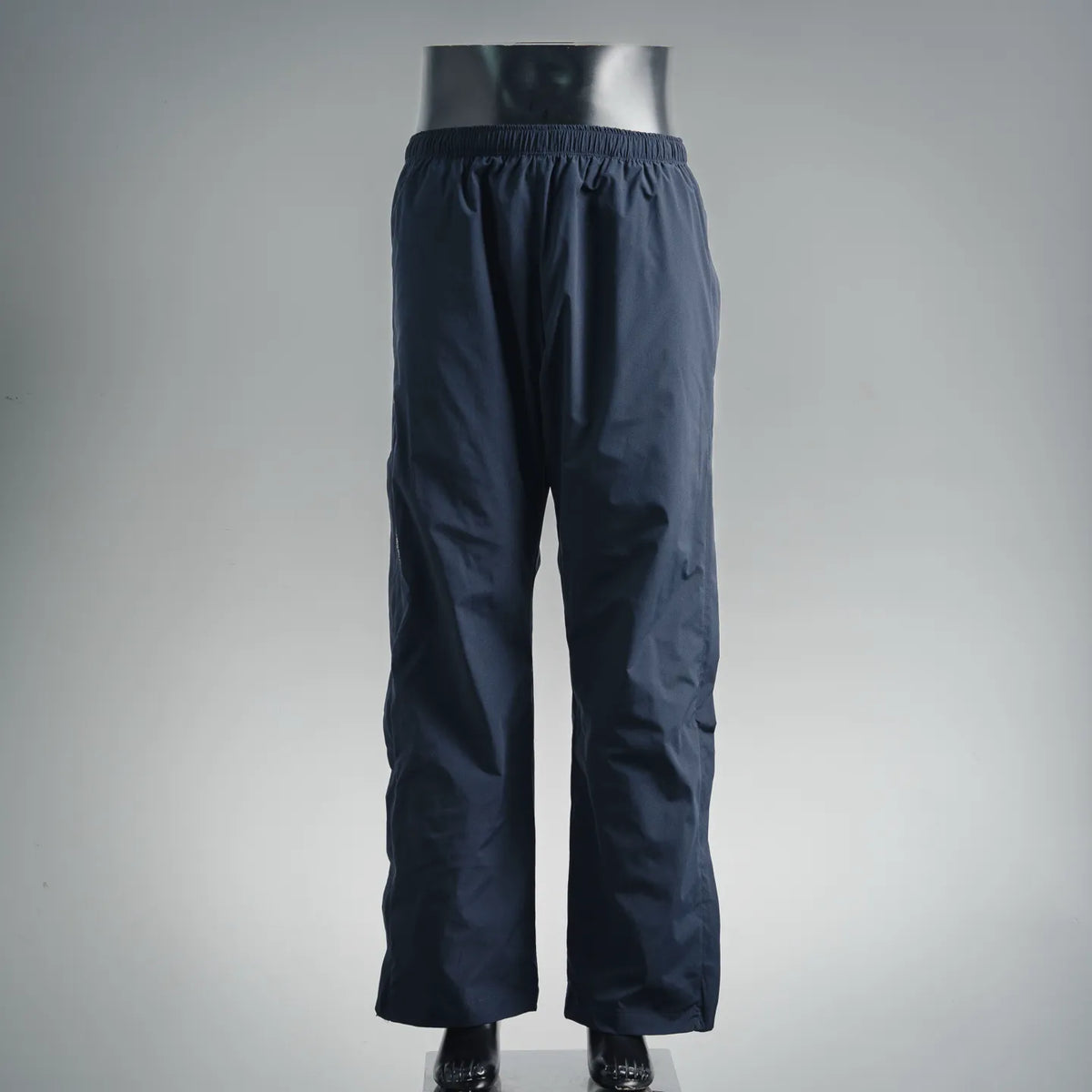 Dark blue track pants with elastic waistband and relaxed straight legs