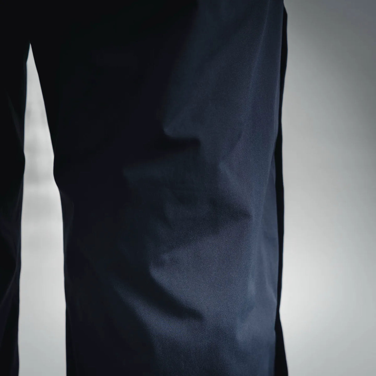 Dark blue pant fabric panel with visible vertical seam