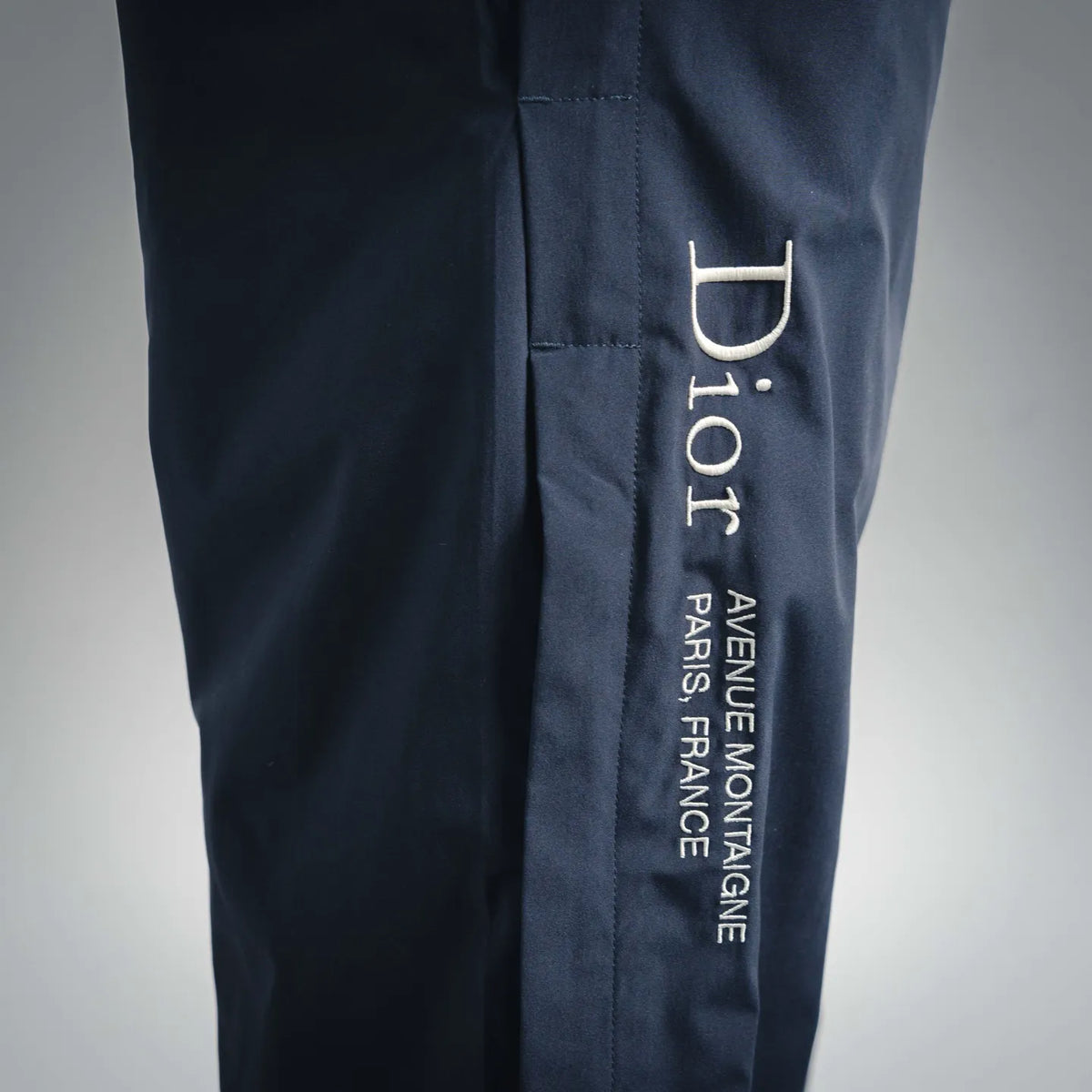 Dark blue pants with Dior Homme printed logo on side