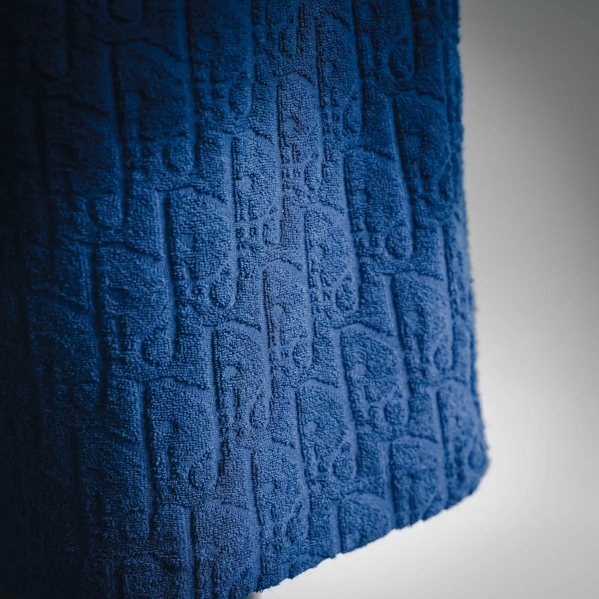 Dior blue textured fabric close-up on pants