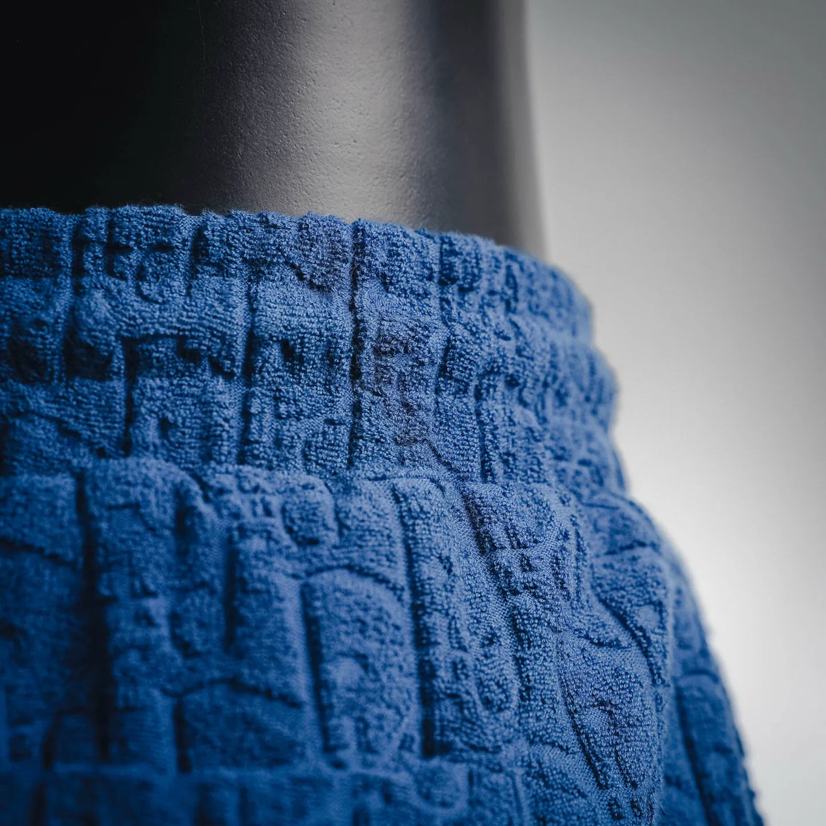 Dior blue textured fabric and elastic waistband detail on pants