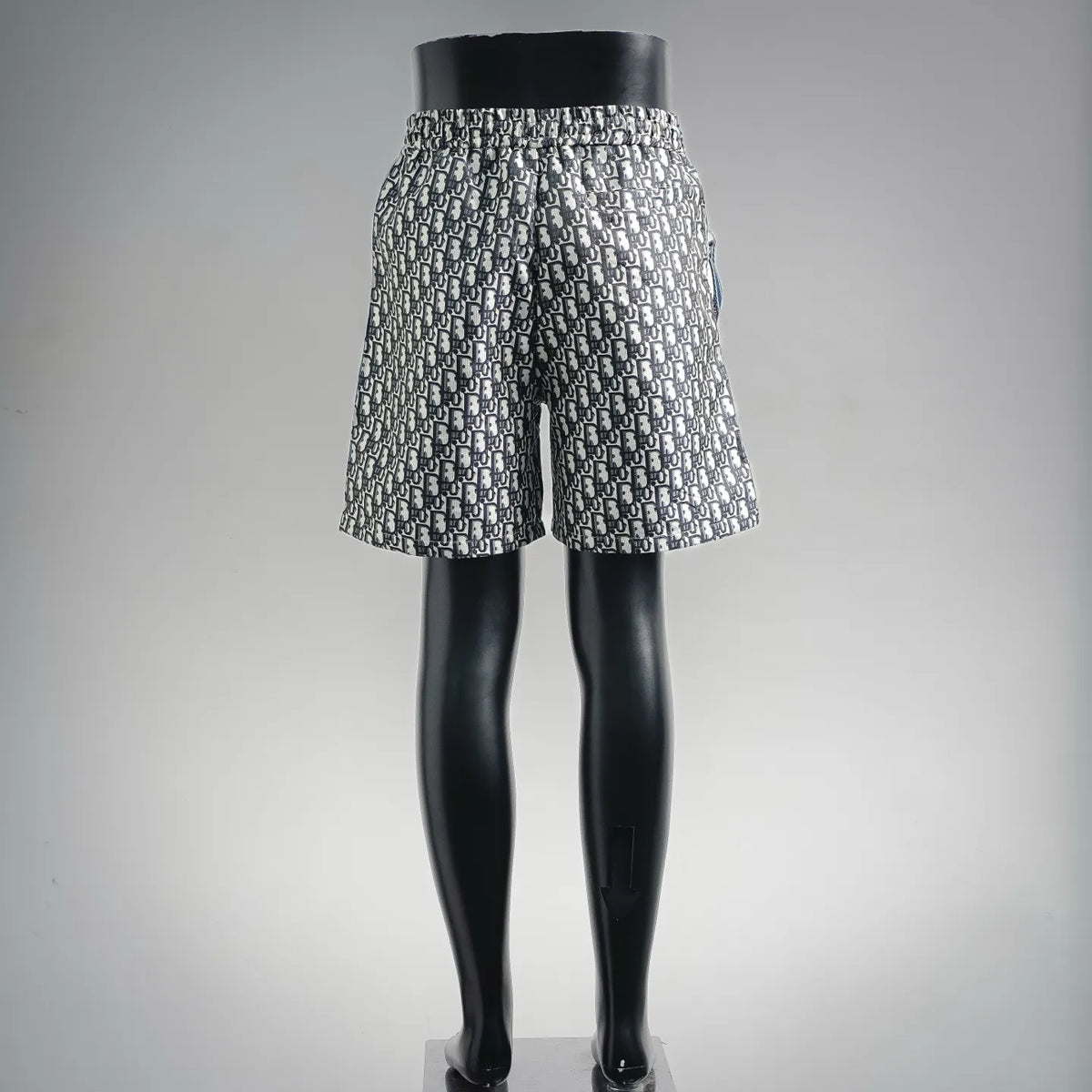 Dior-logo print shorts with gathered elastic waistband, navy and cream repeating design