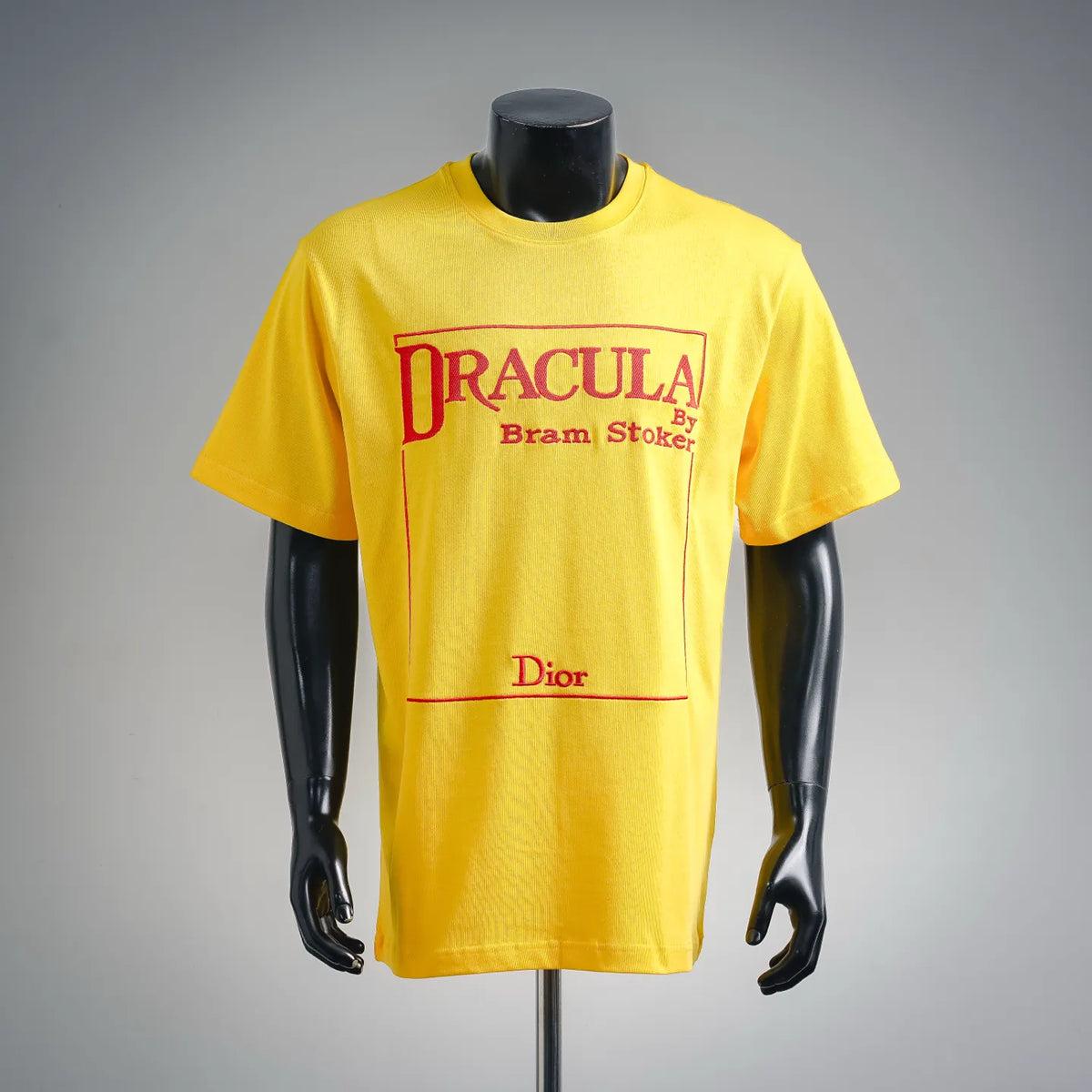 Yellow Dior short-sleeve T-shirt with DRACULA graphic and Bram Stoker text on chest