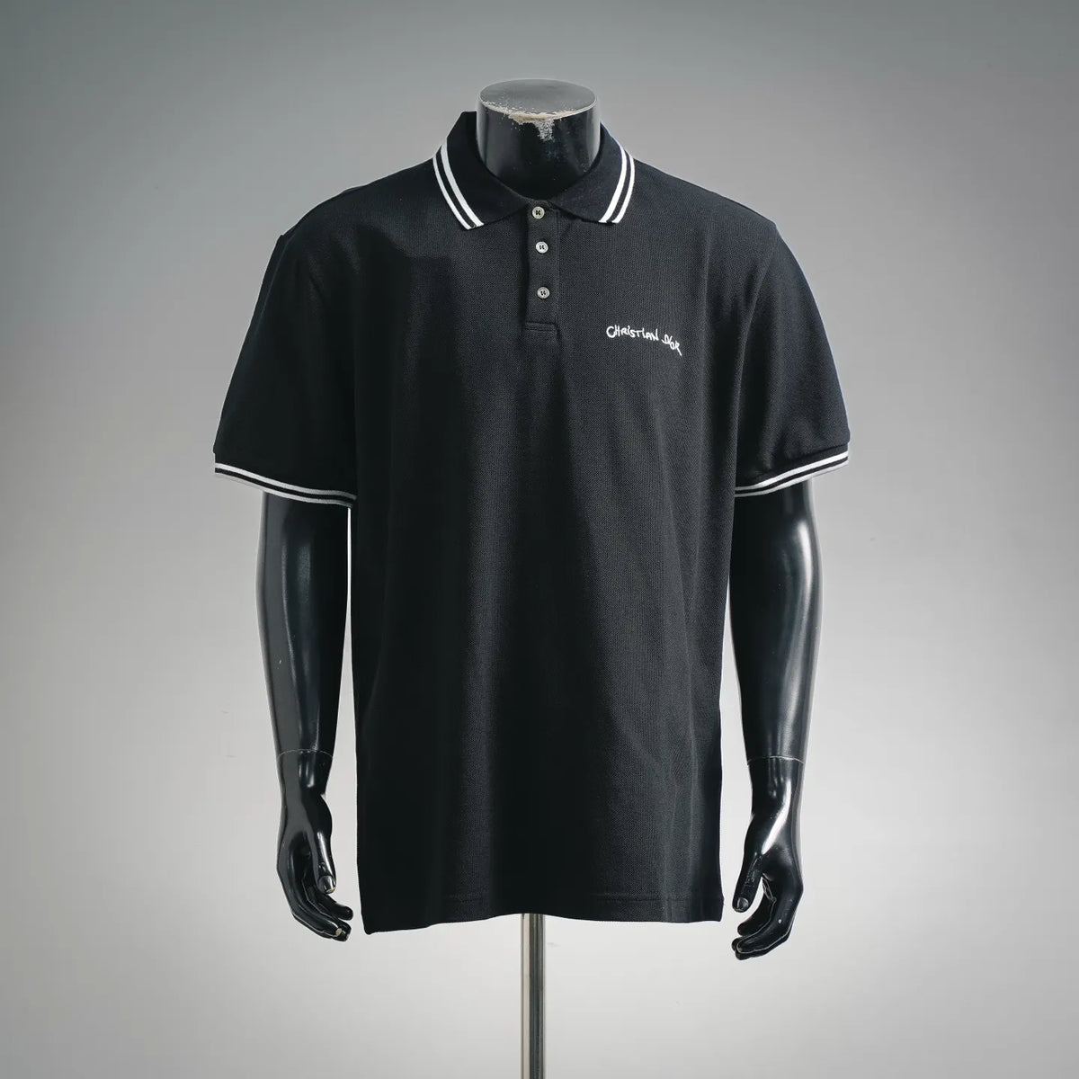Black short-sleeve polo shirt with striped collar, button placket, Christian Dior logo