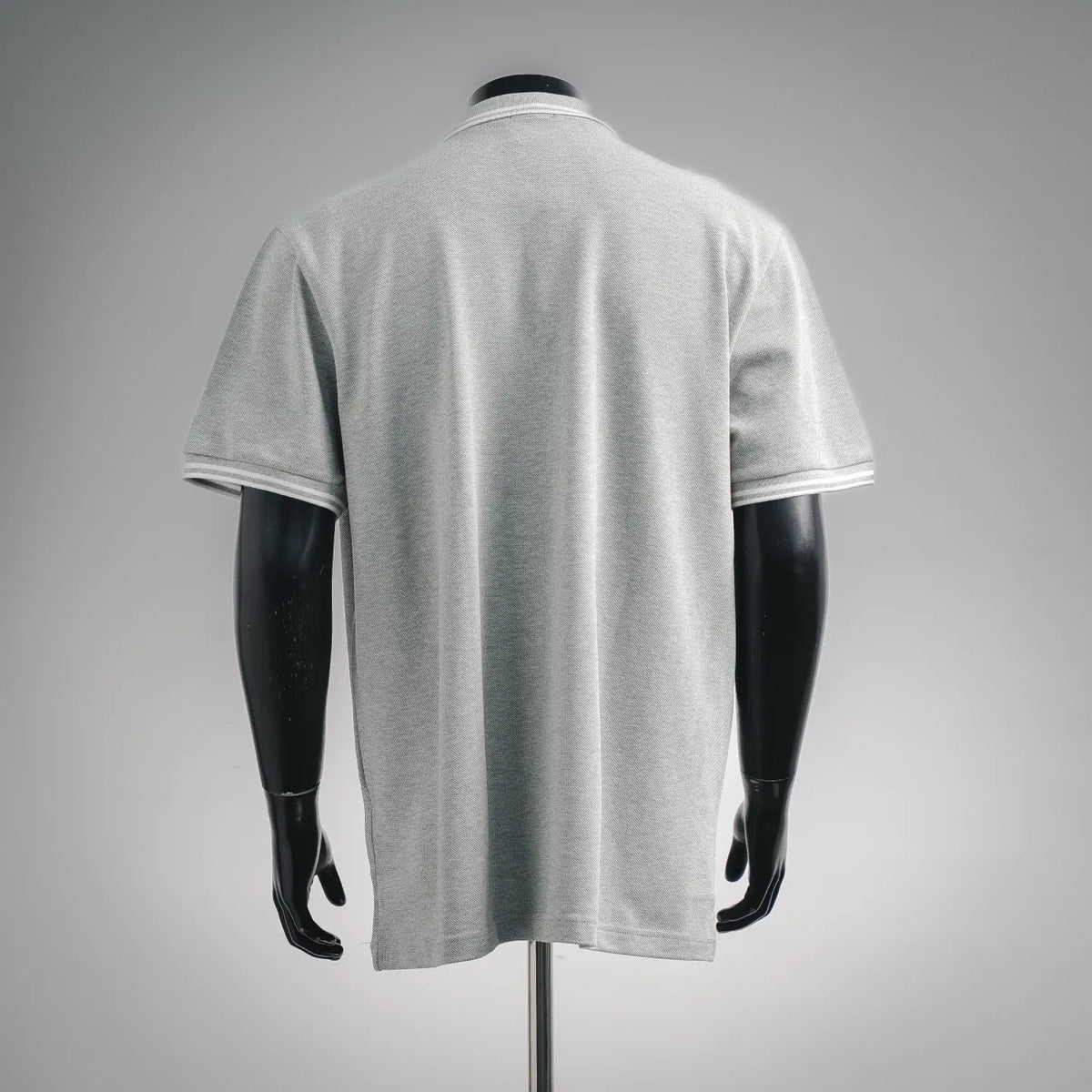 Light gray polo shirt on mannequin, back view with white sleeve trim