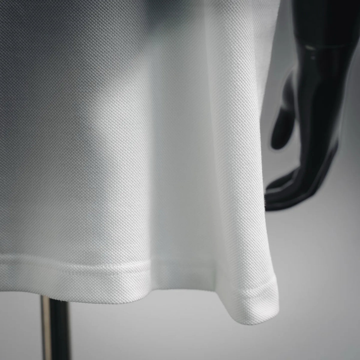 White polo knit fabric close-up