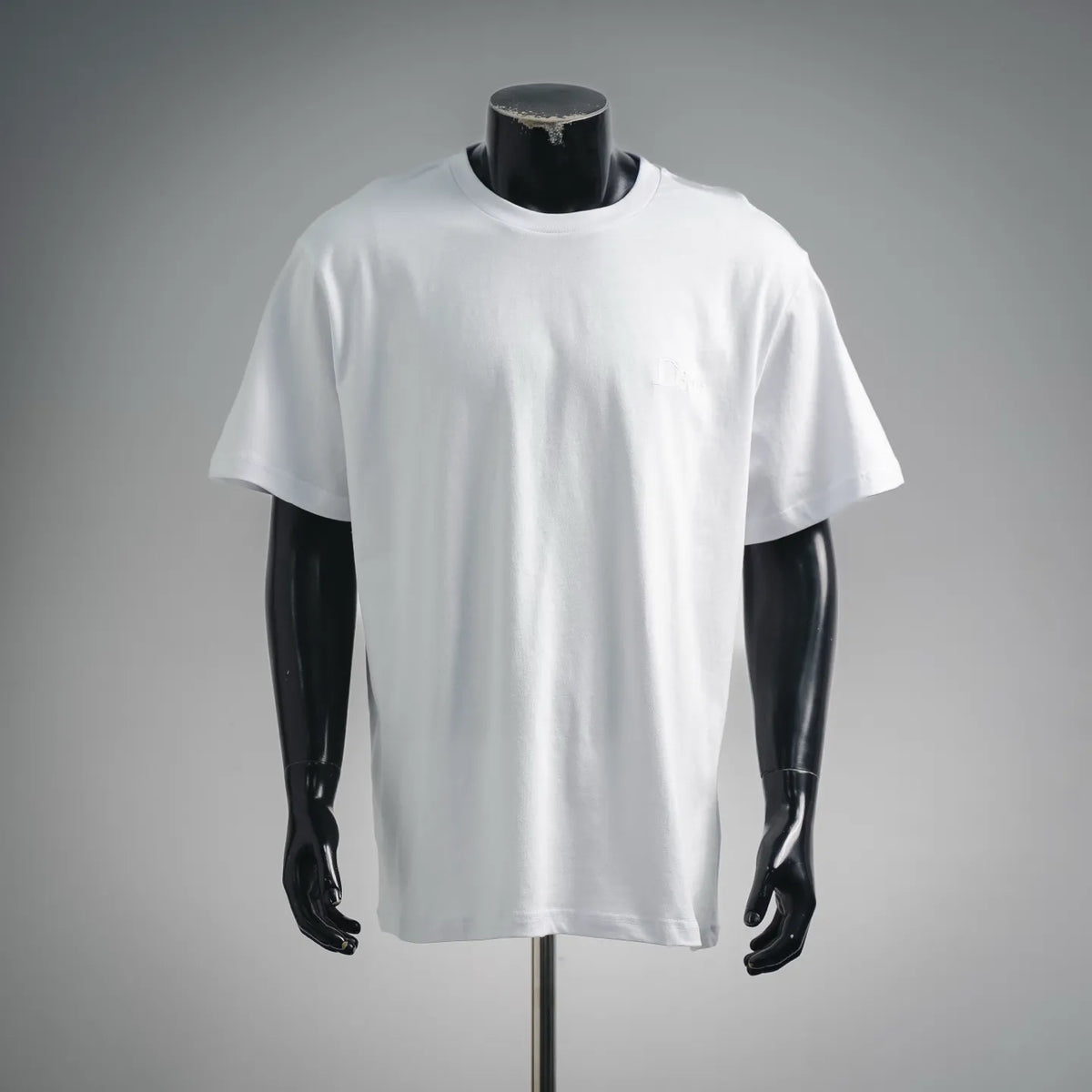 White Dior short-sleeve crewneck T-shirt on mannequin, front view.