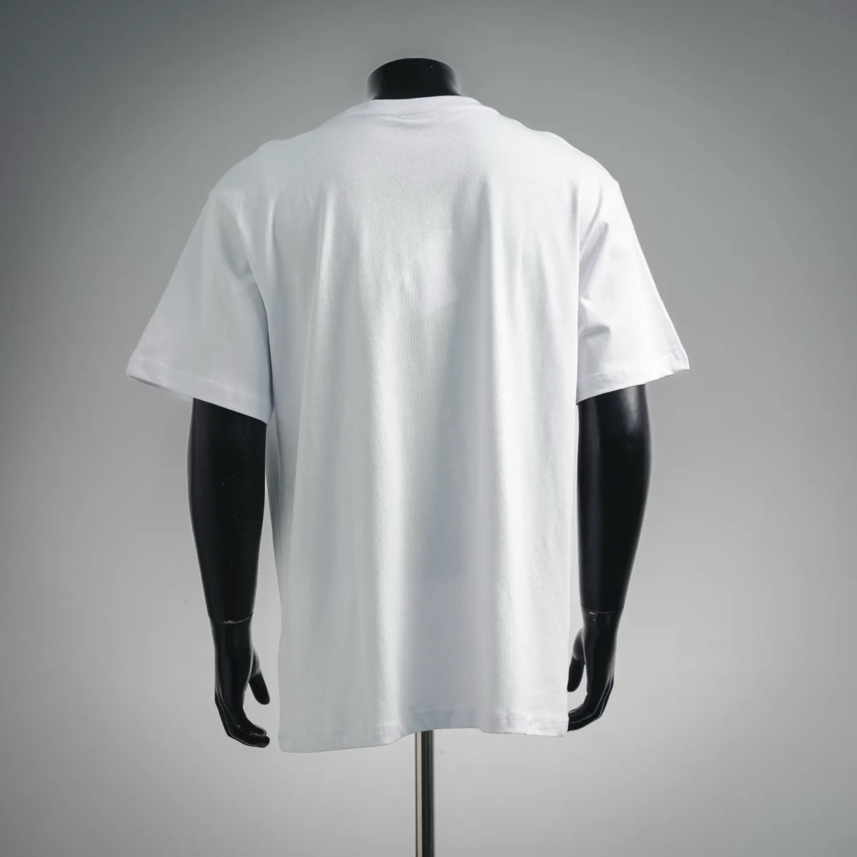 White Dior short-sleeve crewneck T-shirt on mannequin, back view.