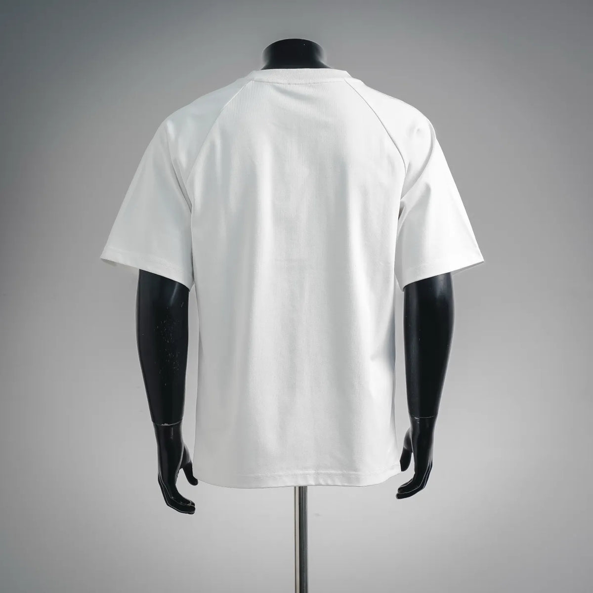 White short-sleeve T-shirt shown from the back on a mannequin