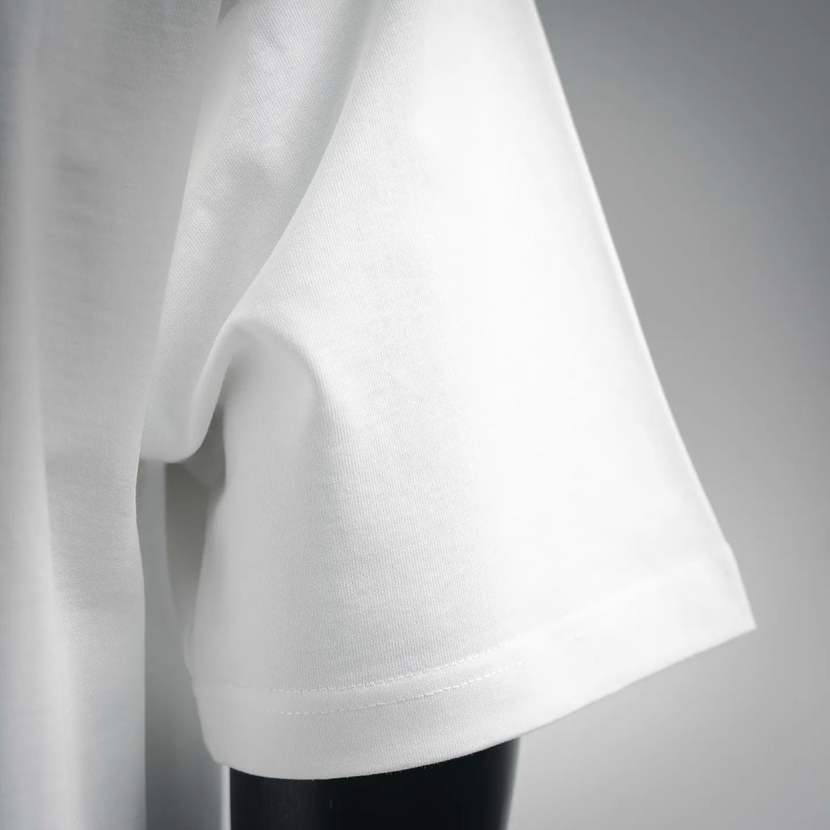 Dior white T-shirt sleeve and hem detail, soft drape and stitching