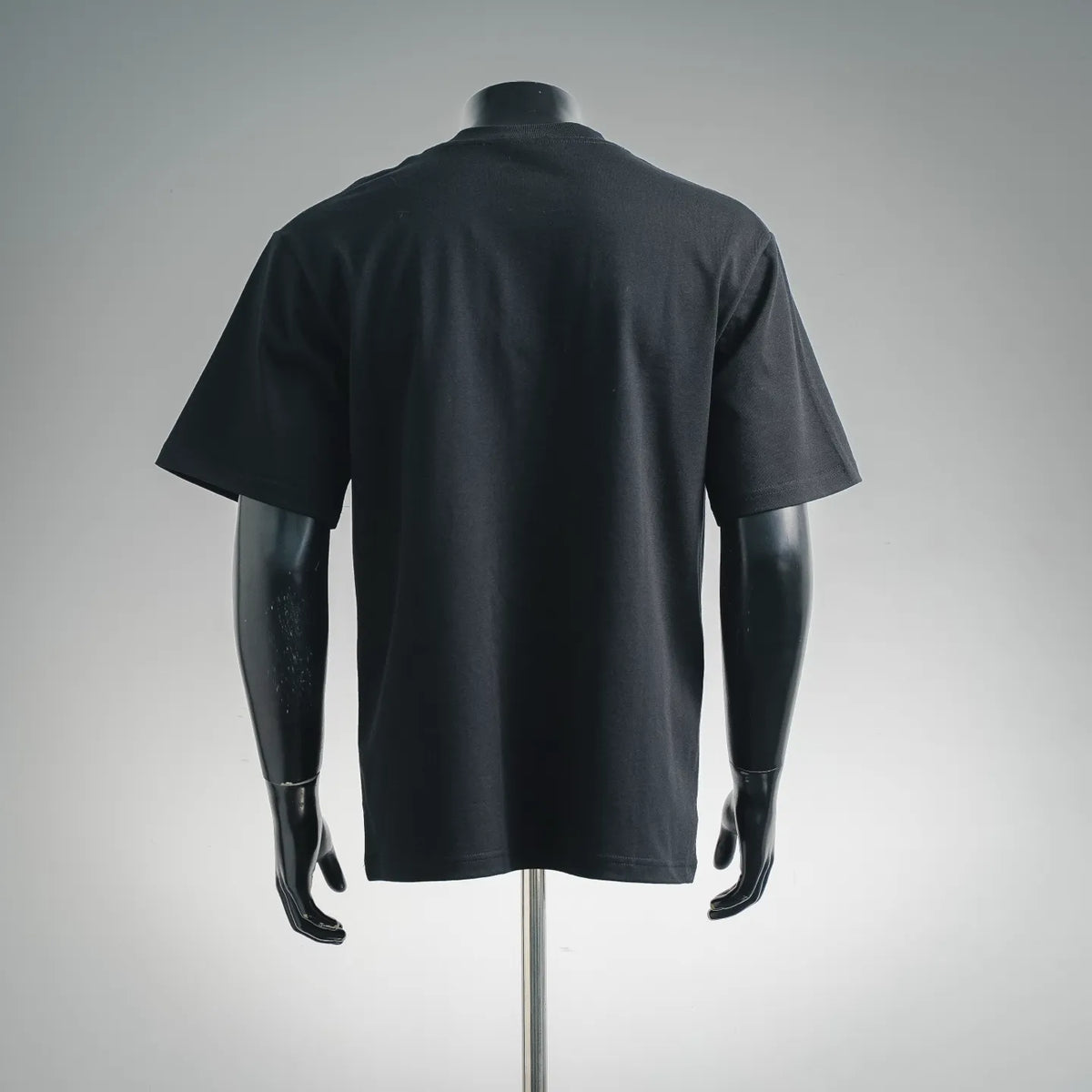 Men's black short-sleeve crewneck T-shirt, back view with plain design