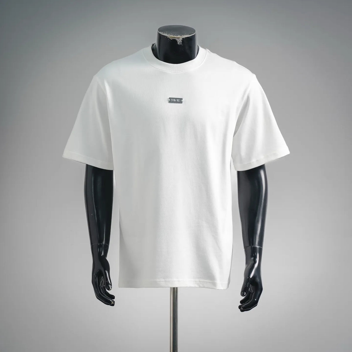 White crewneck T-shirt with small Dior logo at chest, short sleeves