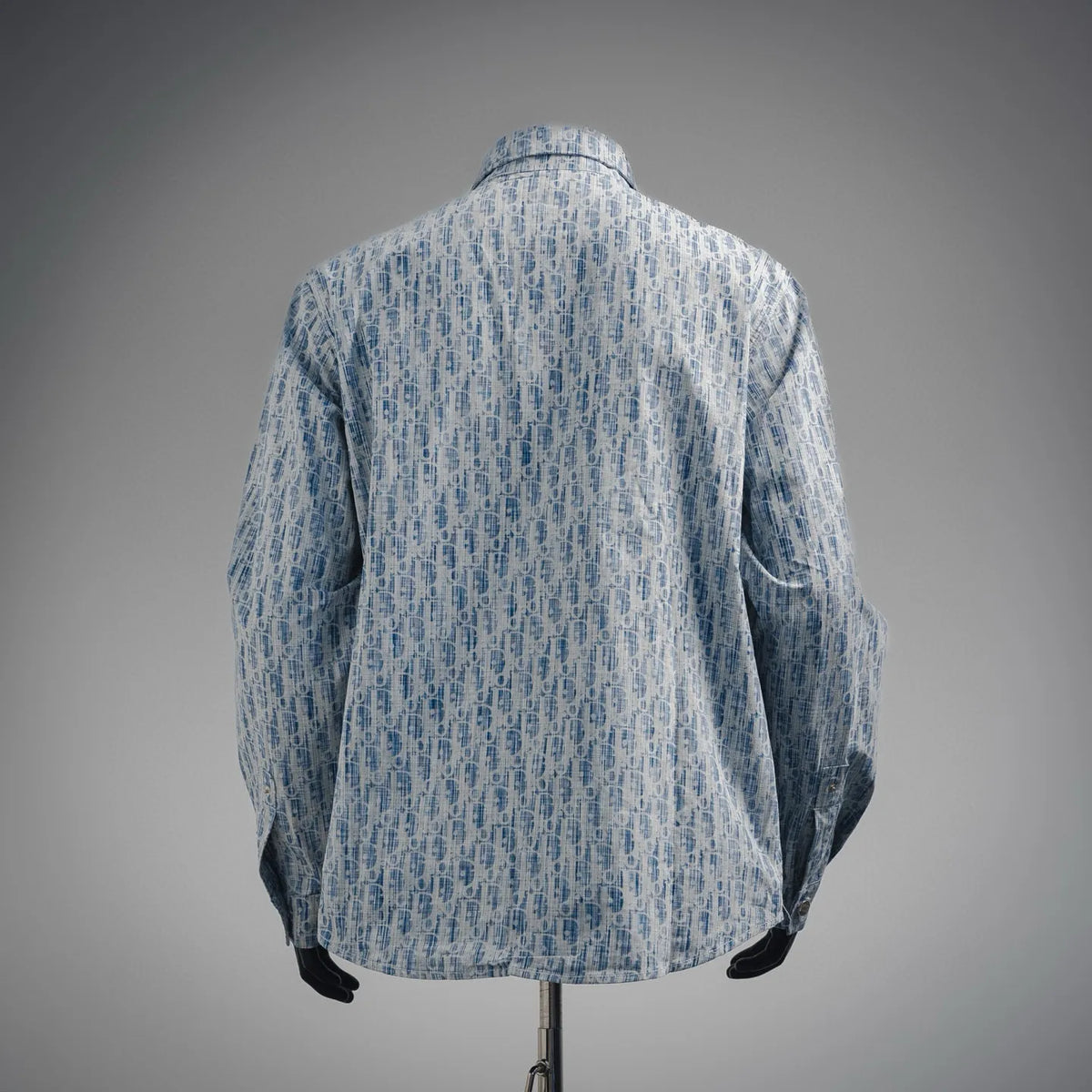 Light blue patterned long-sleeve button-up shirt, back view.