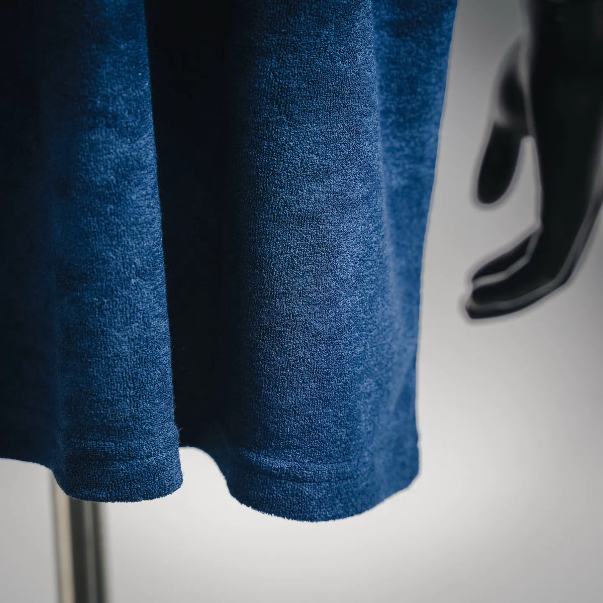 Blue T-shirt hem and short sleeve cuff detail, textured knit