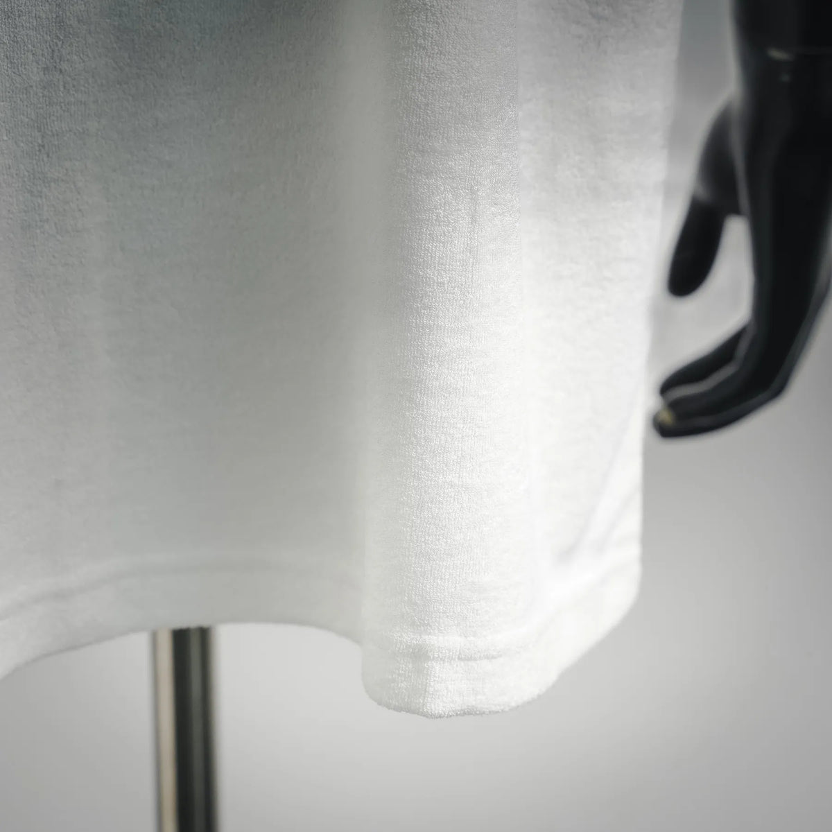 White Christian Dior T-shirt hem and lower front with soft knit texture