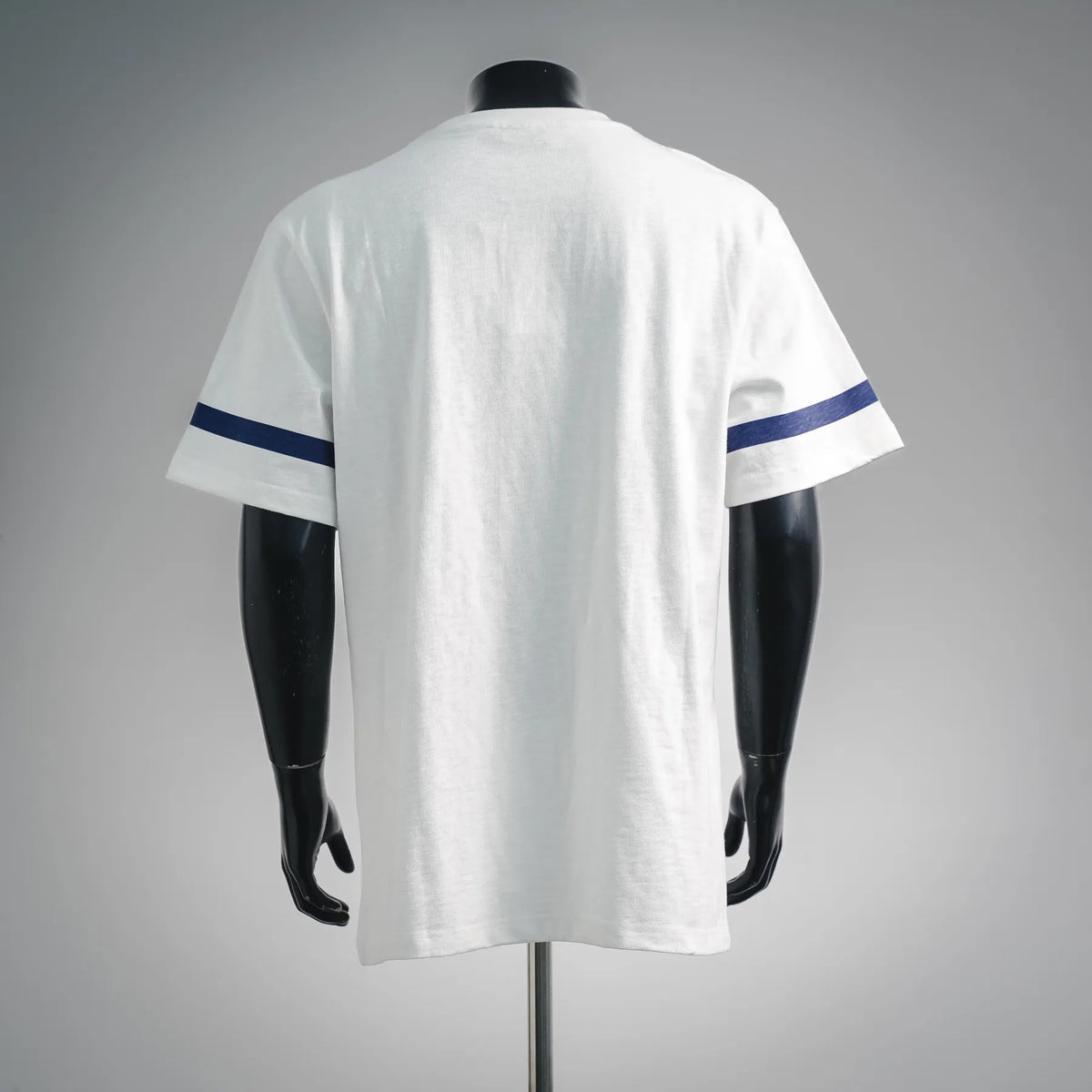 White short-sleeve T-shirt back with blue sleeve stripe detail.
