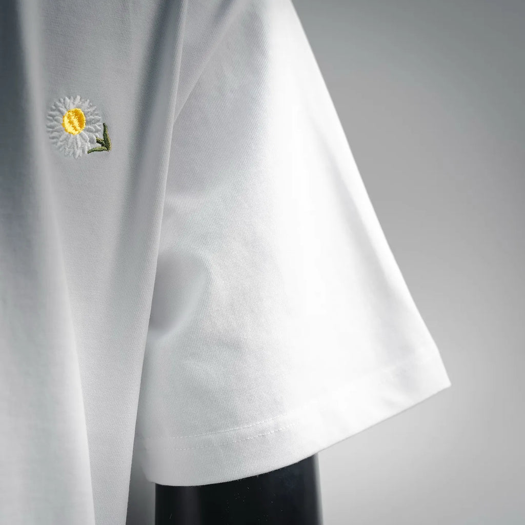White T-shirt with embroidered daisy on left chest, short sleeves