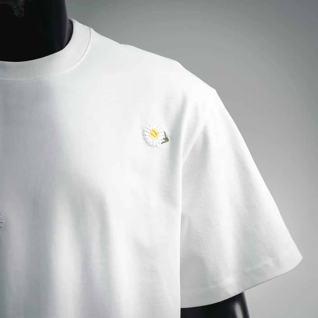 White T-shirt front view with single small daisy on left chest
