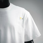 White T-shirt front view with single small daisy on left chest