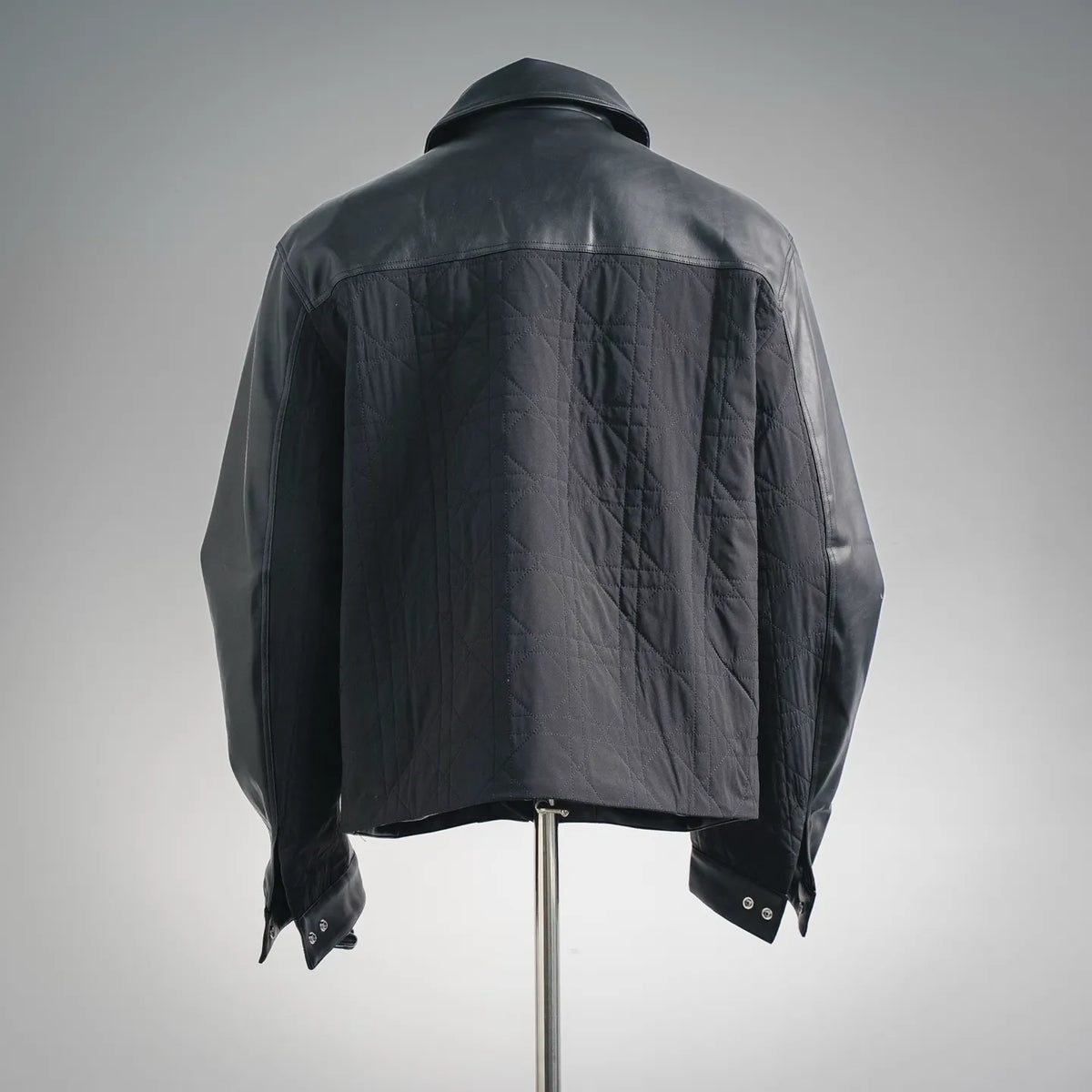 Christian Dior black leather jacket, back view with stand collar and metal snap cuffs