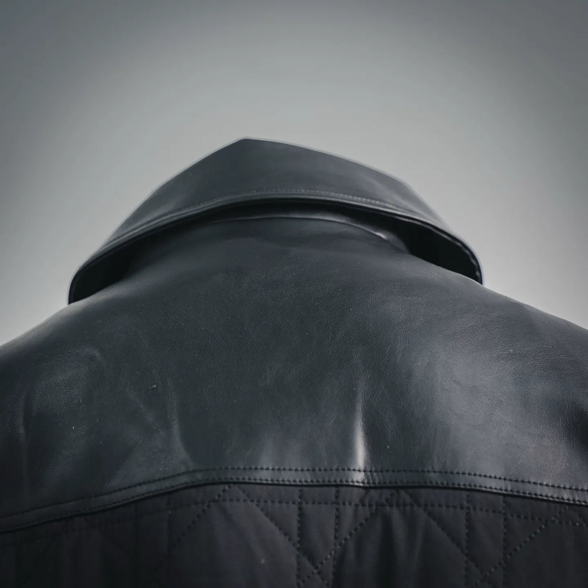 Christian Dior black leather jacket shoulder and upper back detail, smooth leather and quilting