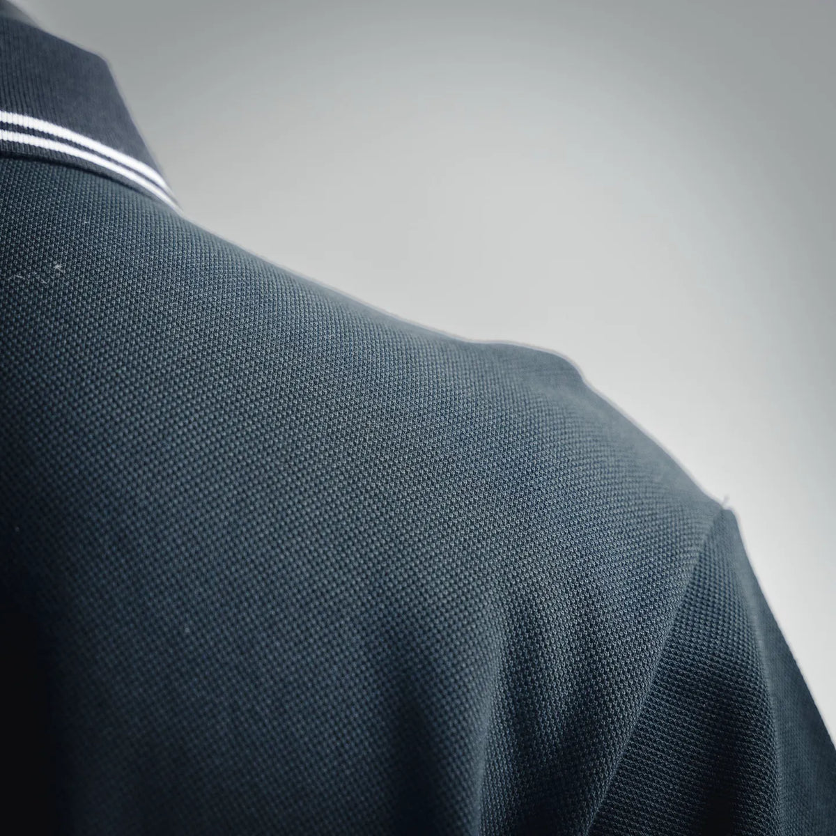 Close-up of navy polo fabric texture