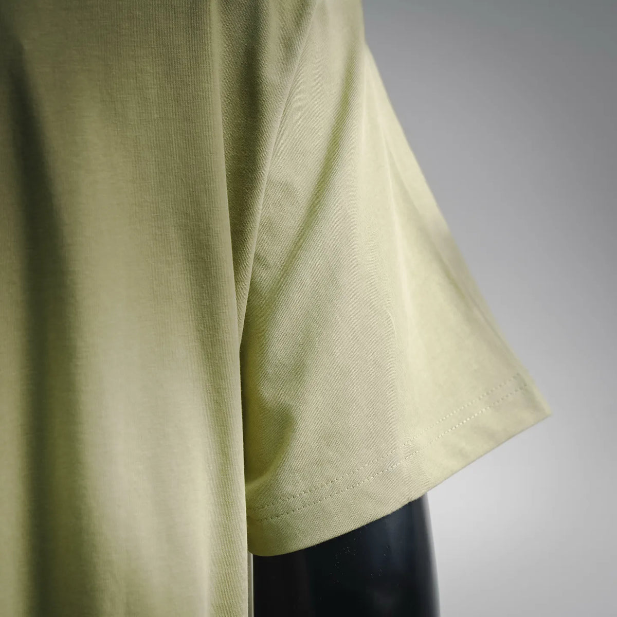 Lime green T-shirt with short sleeves and side seam stitching