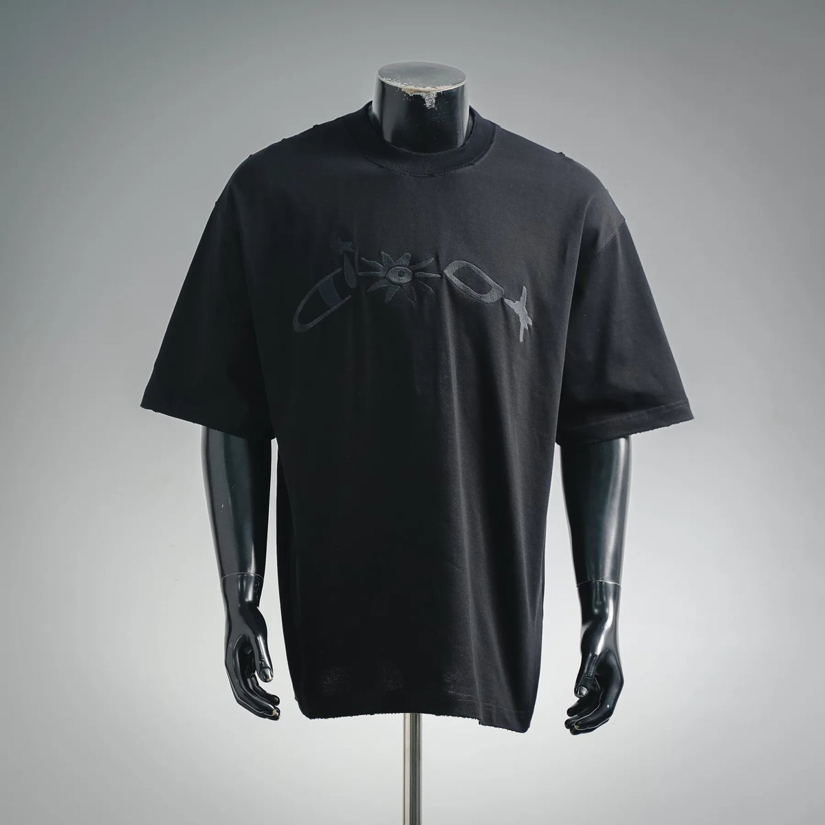 Black crewneck T-shirt with graphic emblem and '30' print