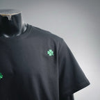 Black Dior T-shirt with green clover logo on chest