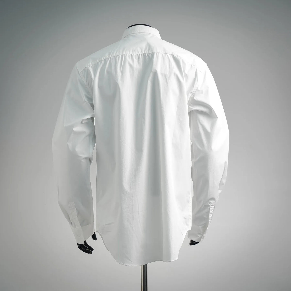 White long-sleeve button-up shirt, back view with yoke seam detail
