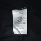 Clothing care and size label on dark Dior short-sleeve T-shirt