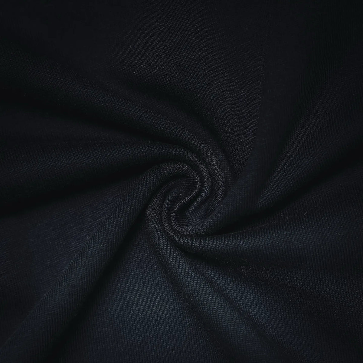 Close-up of dark T-shirt knit fabric texture