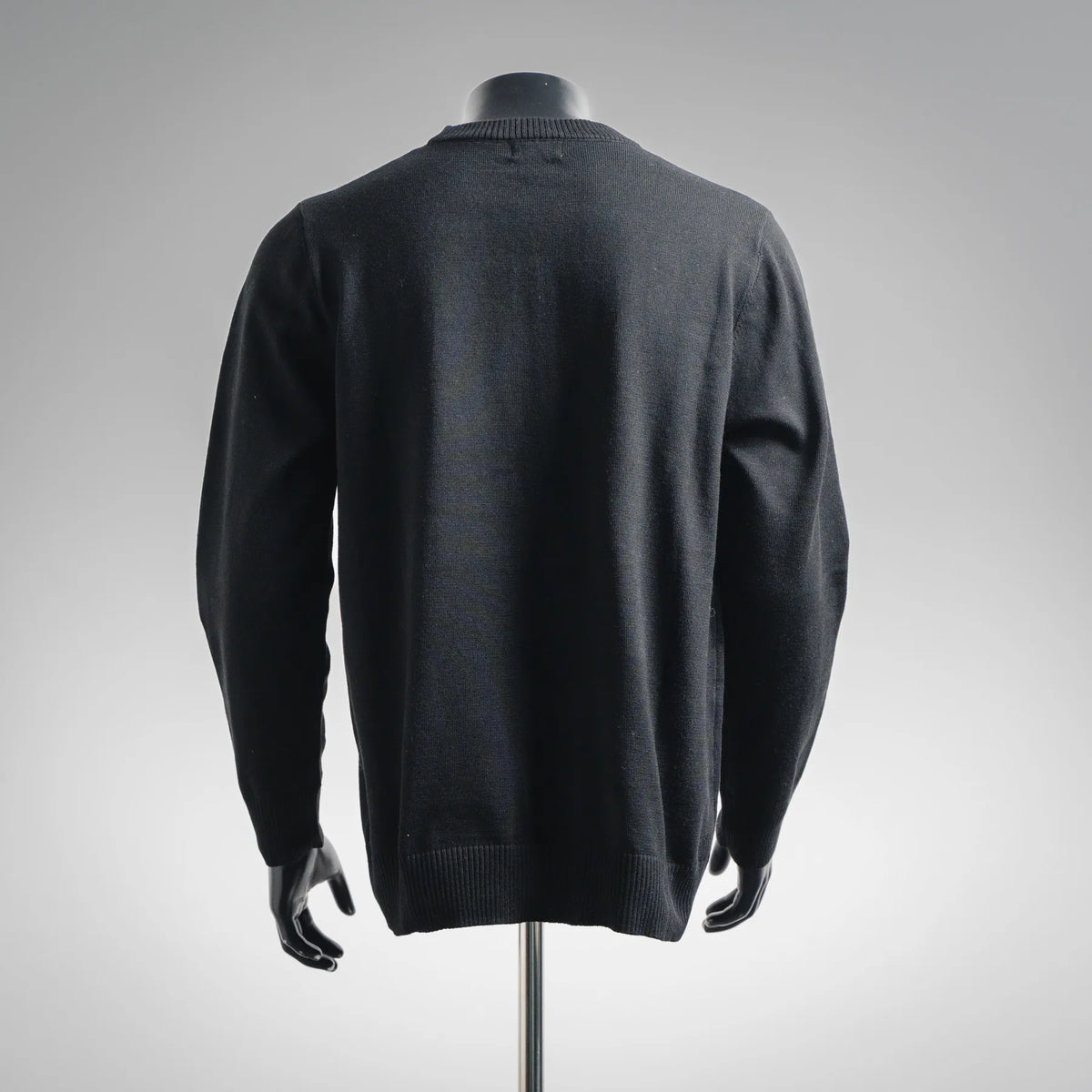 Black crewneck knit sweater, back view with ribbed hem and cuffs