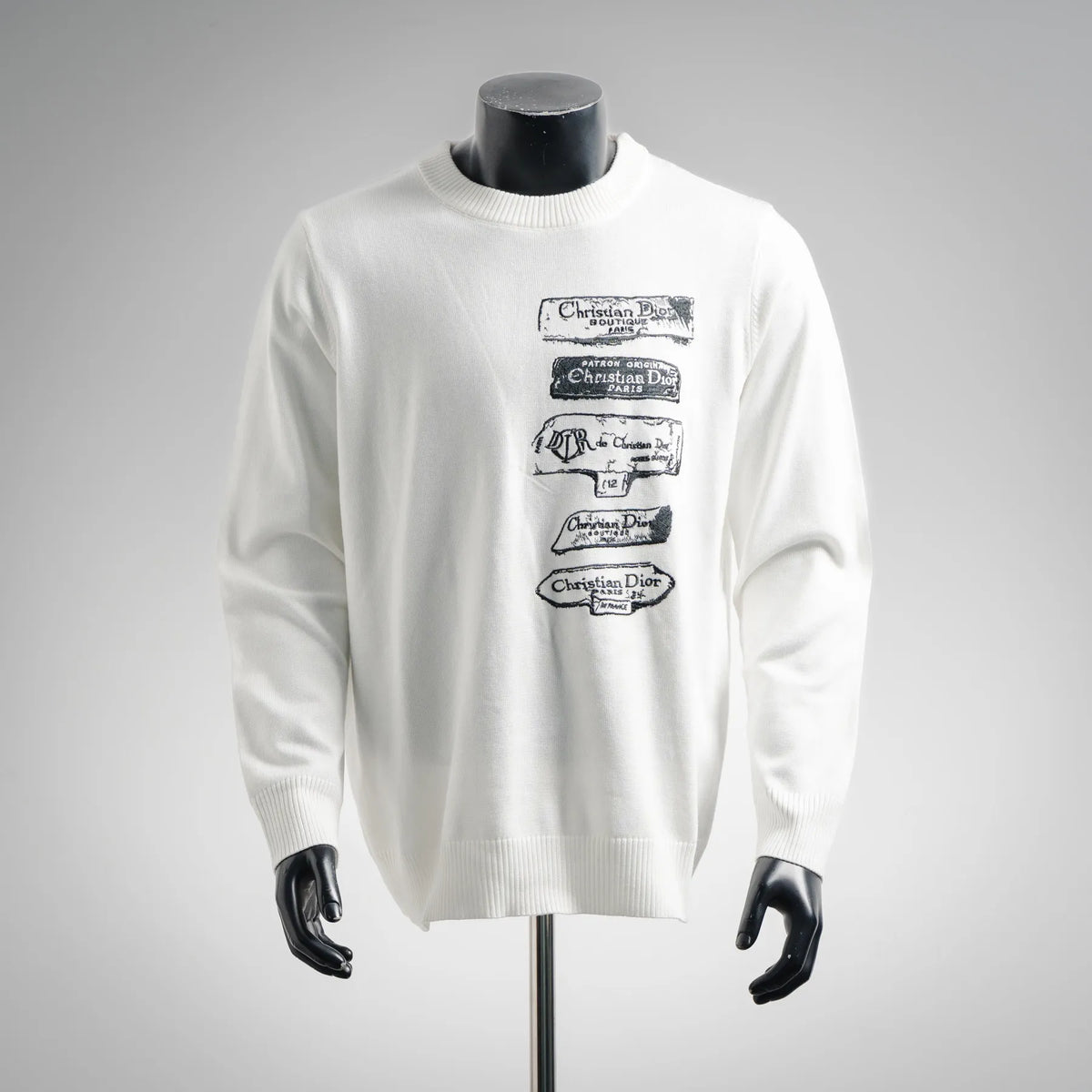 White long-sleeve crewneck sweater with Dior logo graphic on chest