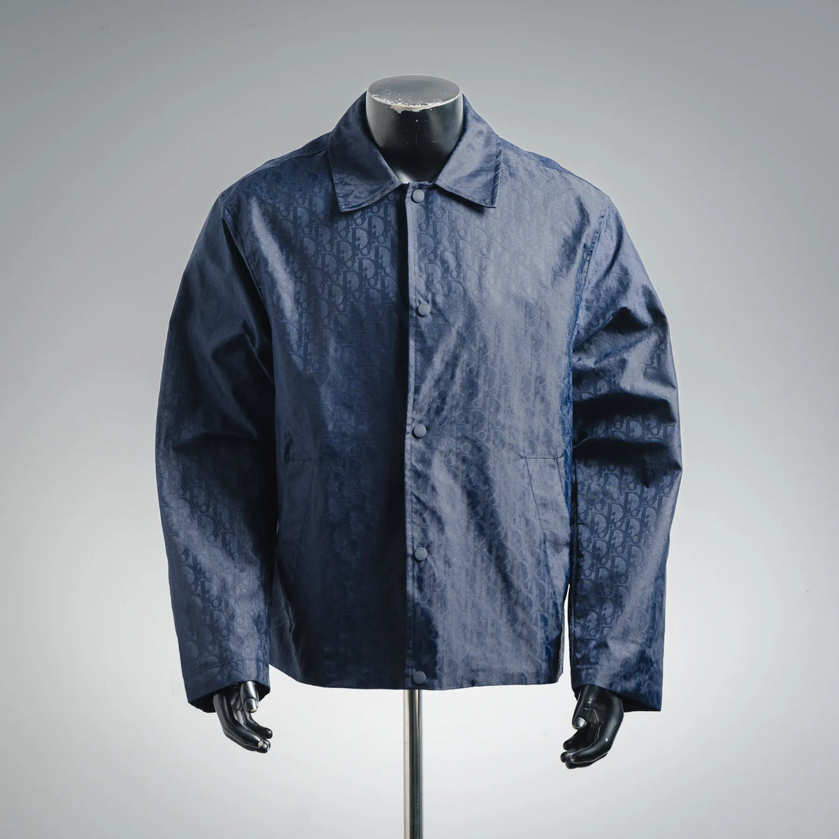 Dior logo-pattern coat in dark blue with button front and pointed collar