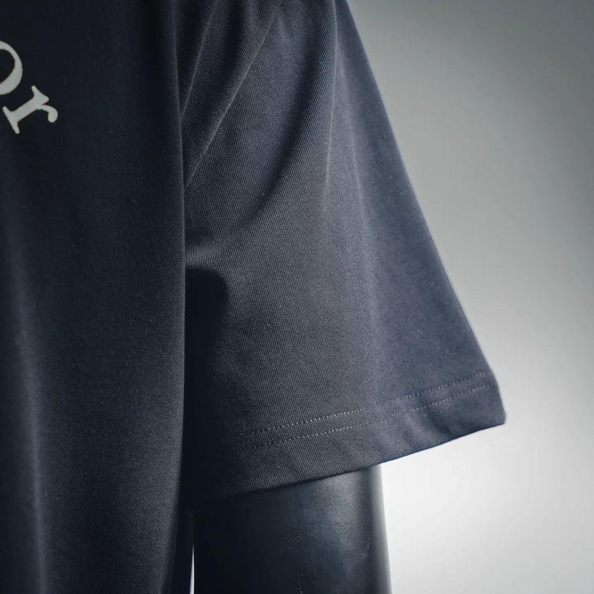 Black T-shirt side hem with stitched hemline detail