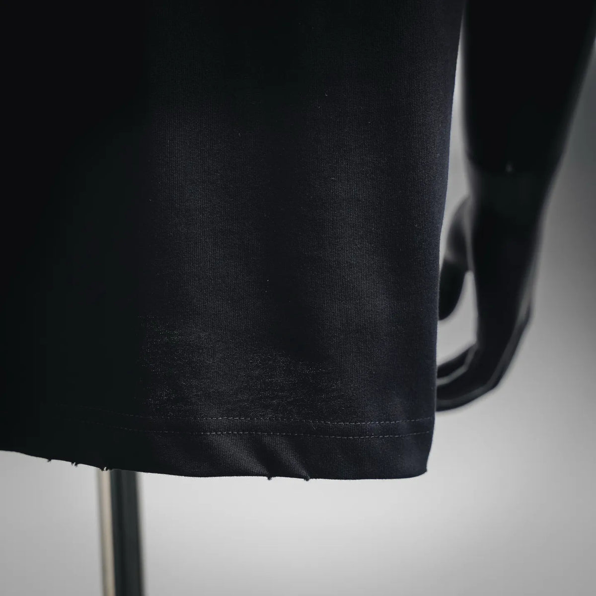 Black T-shirt bottom hem with double-stitched edge