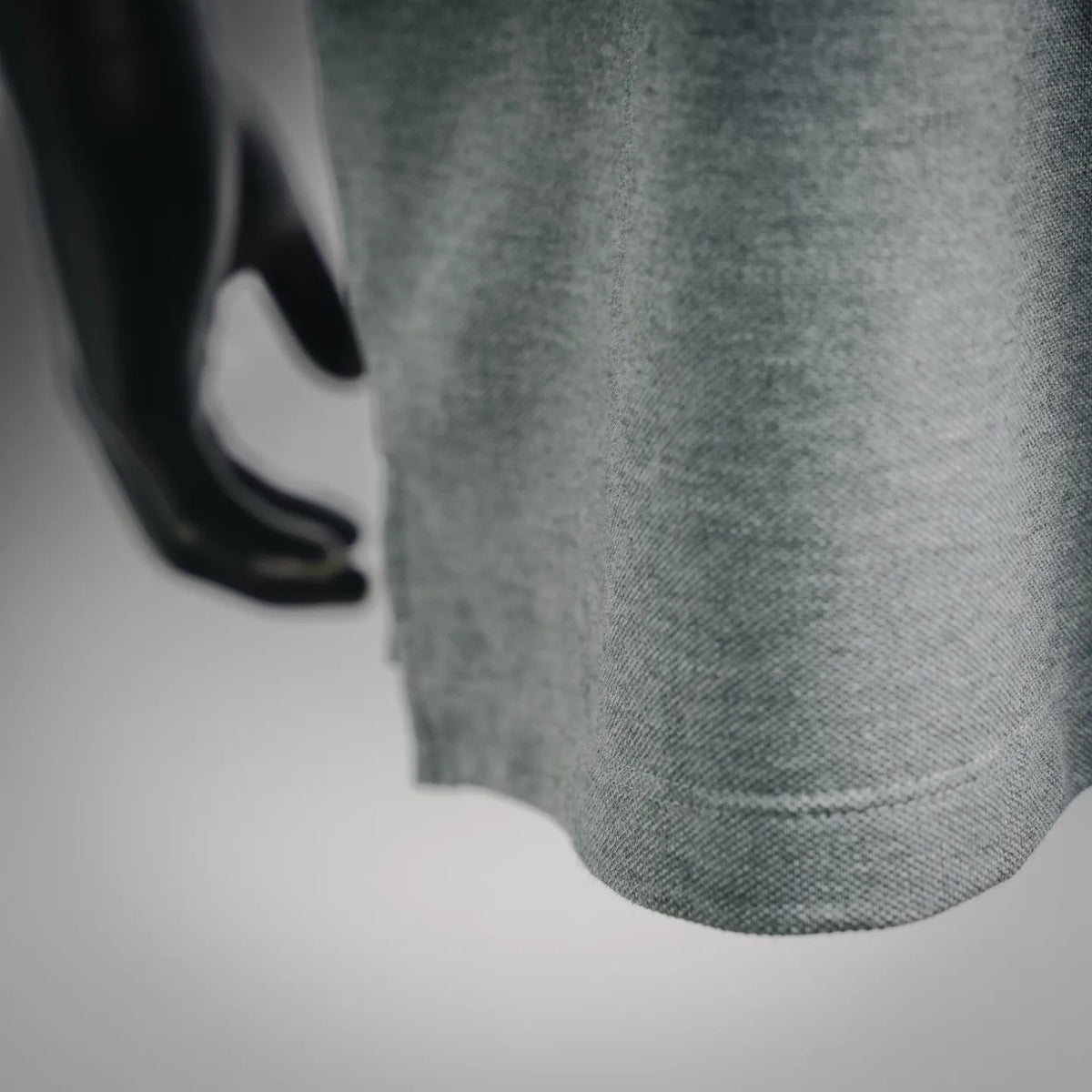 Dior gray polo shirt hem close-up