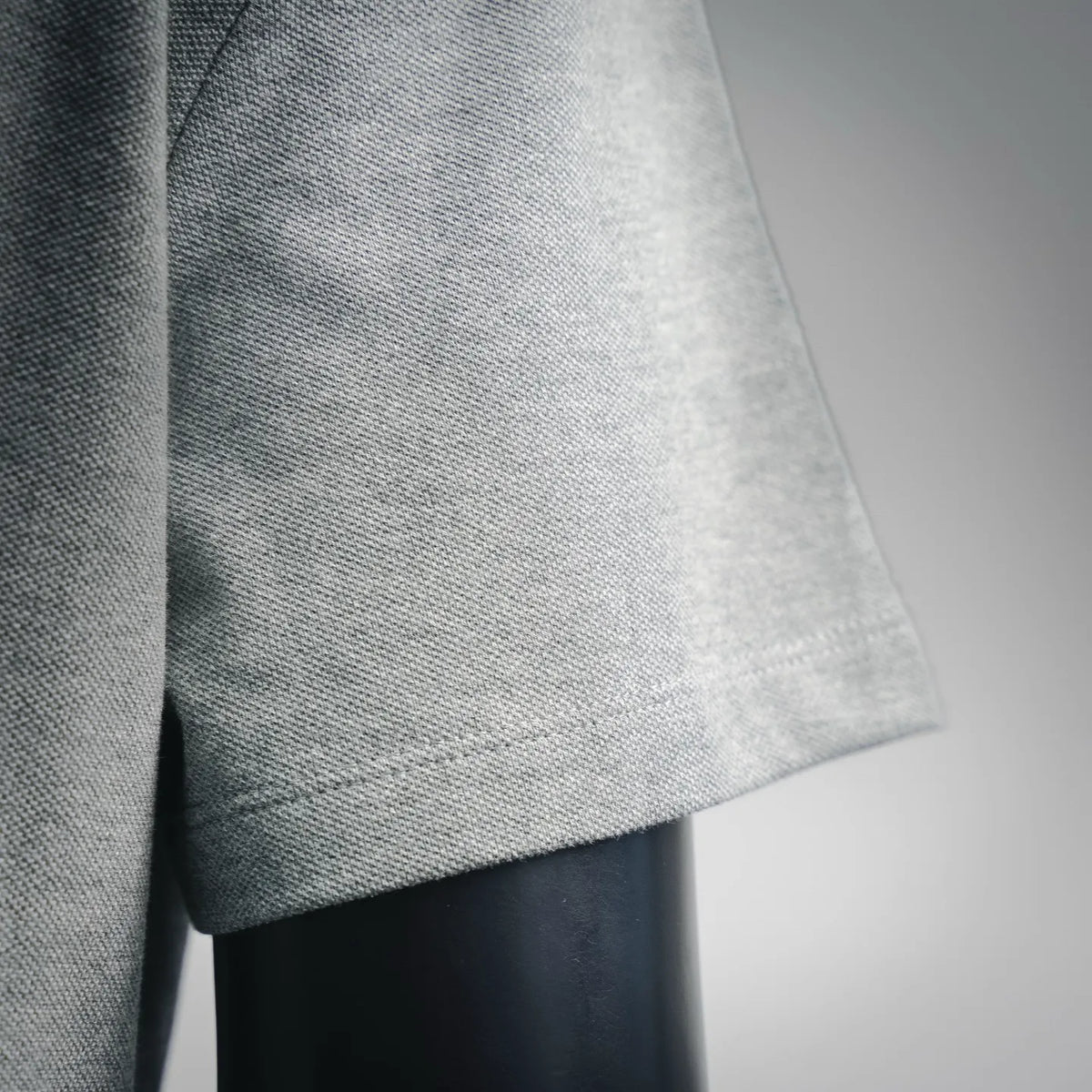 Dior gray polo shirt sleeve cuff and fabric texture close-up