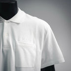 White Dior polo shirt chest pocket with embroidered Dior logo.