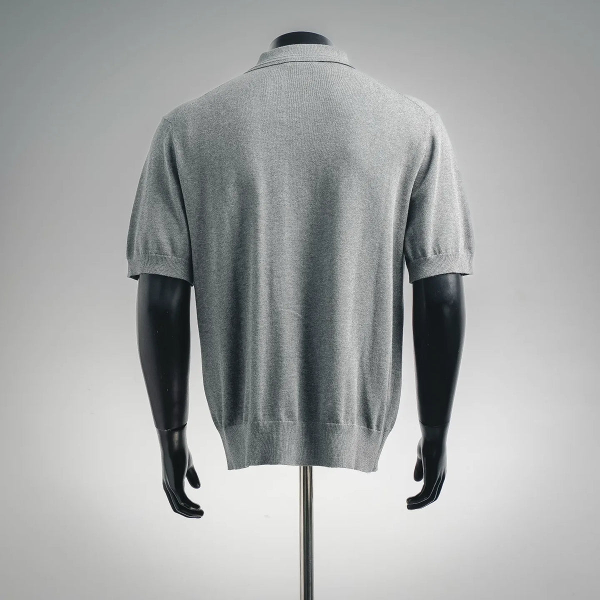 Dior knit polo shirt, short sleeves, back view in light heather gray
