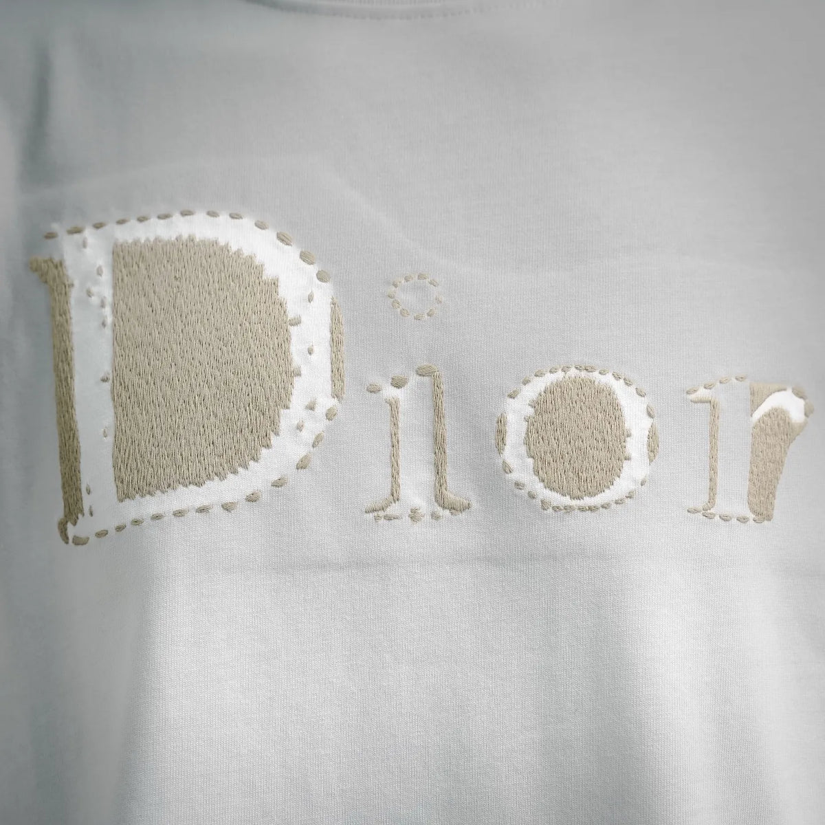 Embroidered Dior lettering on a white T-shirt
