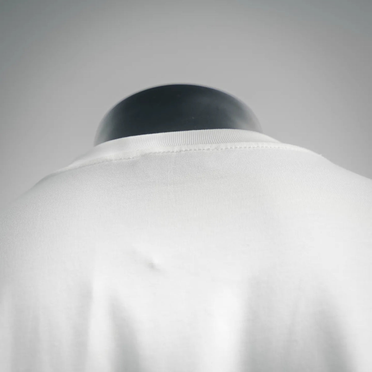 Dior white T-shirt back collar area with smooth seam finish