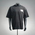 Black short-sleeve T-shirt with white chest Dior logo patch on a mannequin